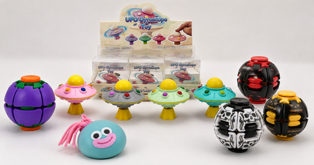 Wholesale novelty toys assortment featuring UFO gyroscope spinners, squeeze toys and rotating fidget balls for retail testing