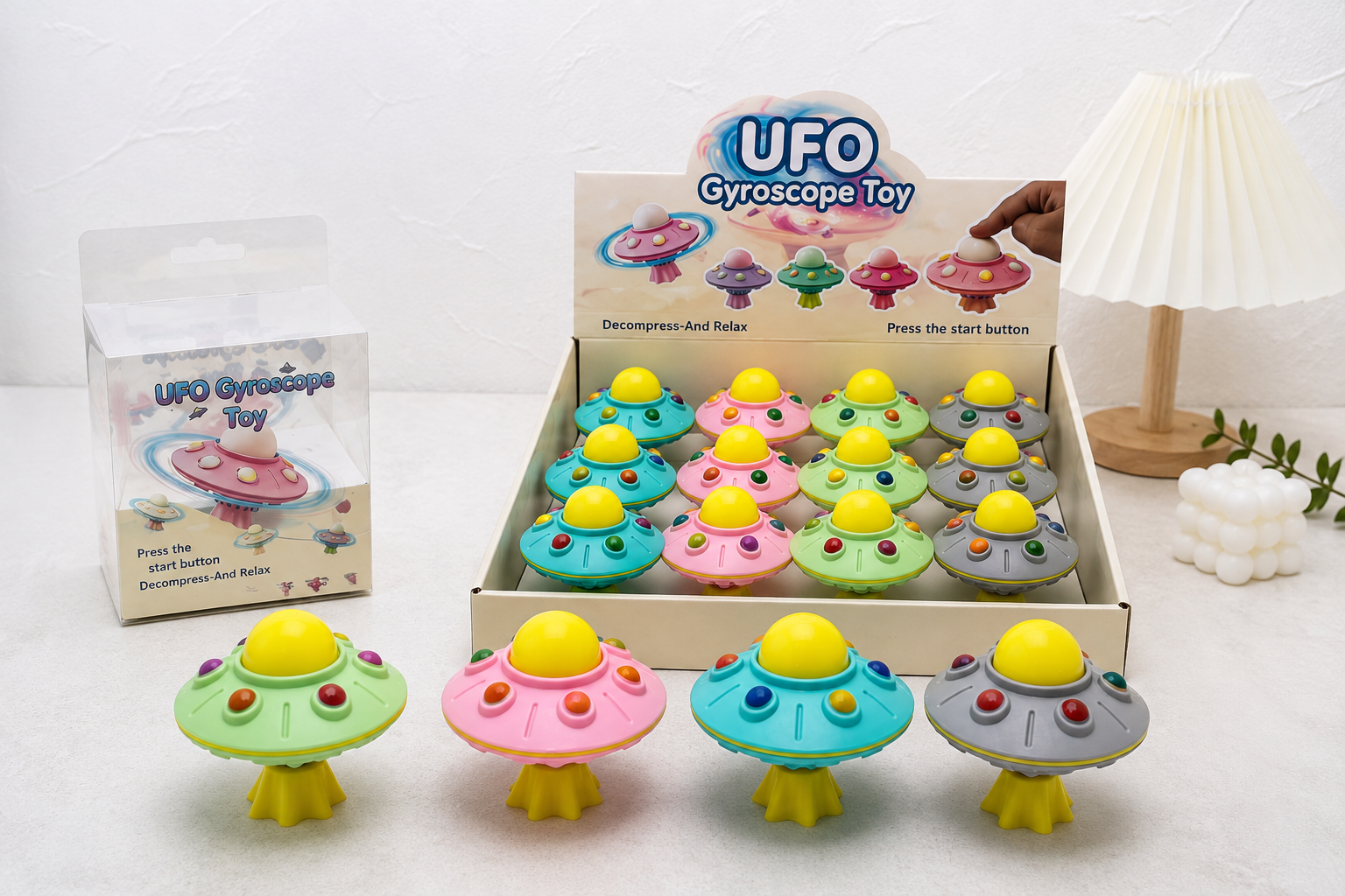Gyroscope toy wholesale packaging showing individual boxes and countertop display formats