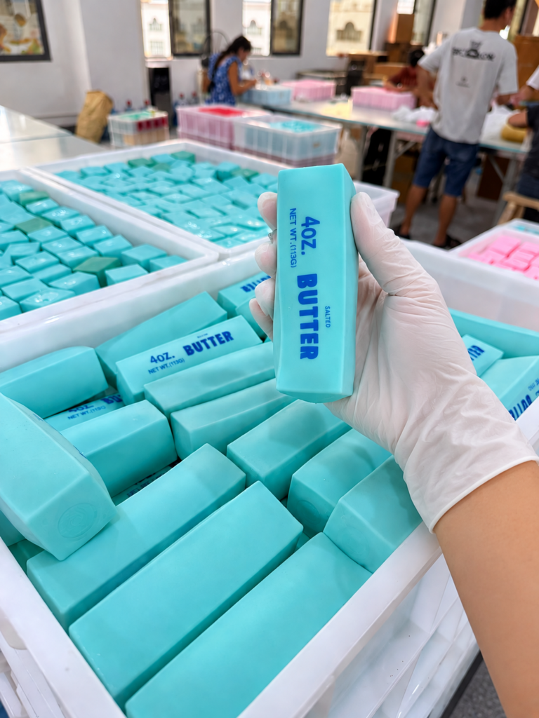 Squishy toy manufacturer inspecting butter squishy toys during factory production