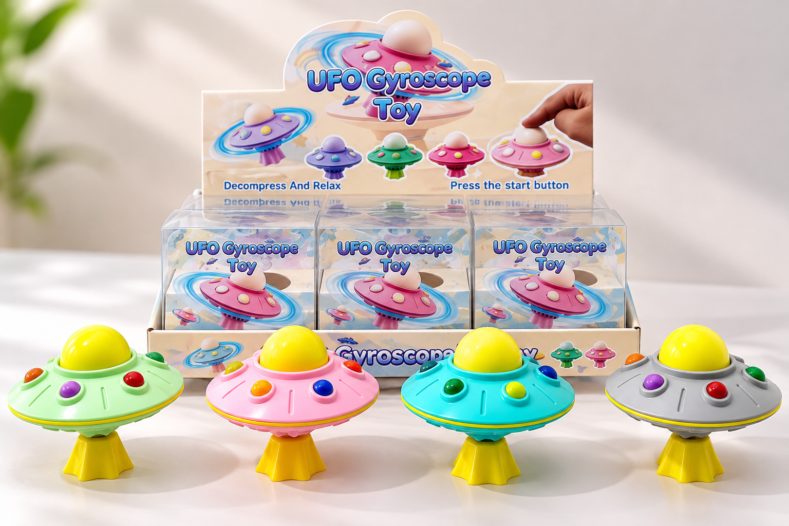 UFO gyroscope fidget toys displayed with packaging that shows the spinning interaction