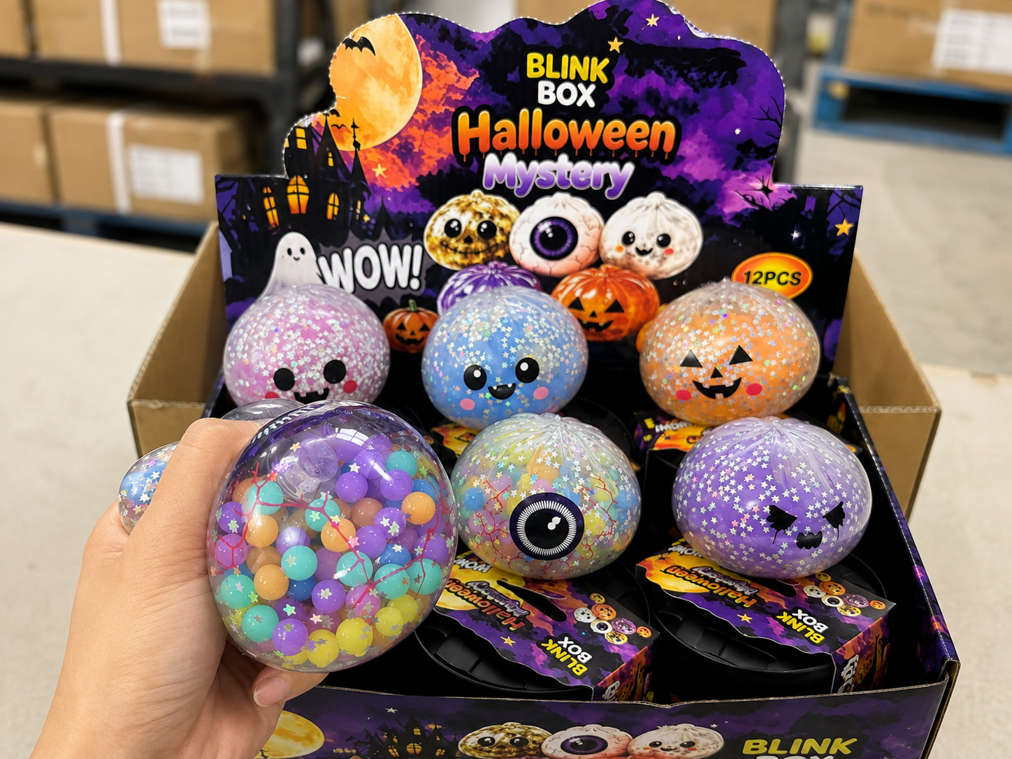 Squishy toy inspection with hand squeeze test and multiple Halloween sensory ball samples for consistency review